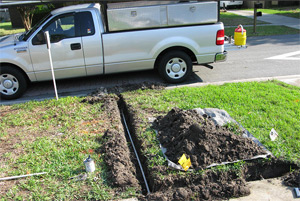 Exposed PVC piping and work truck